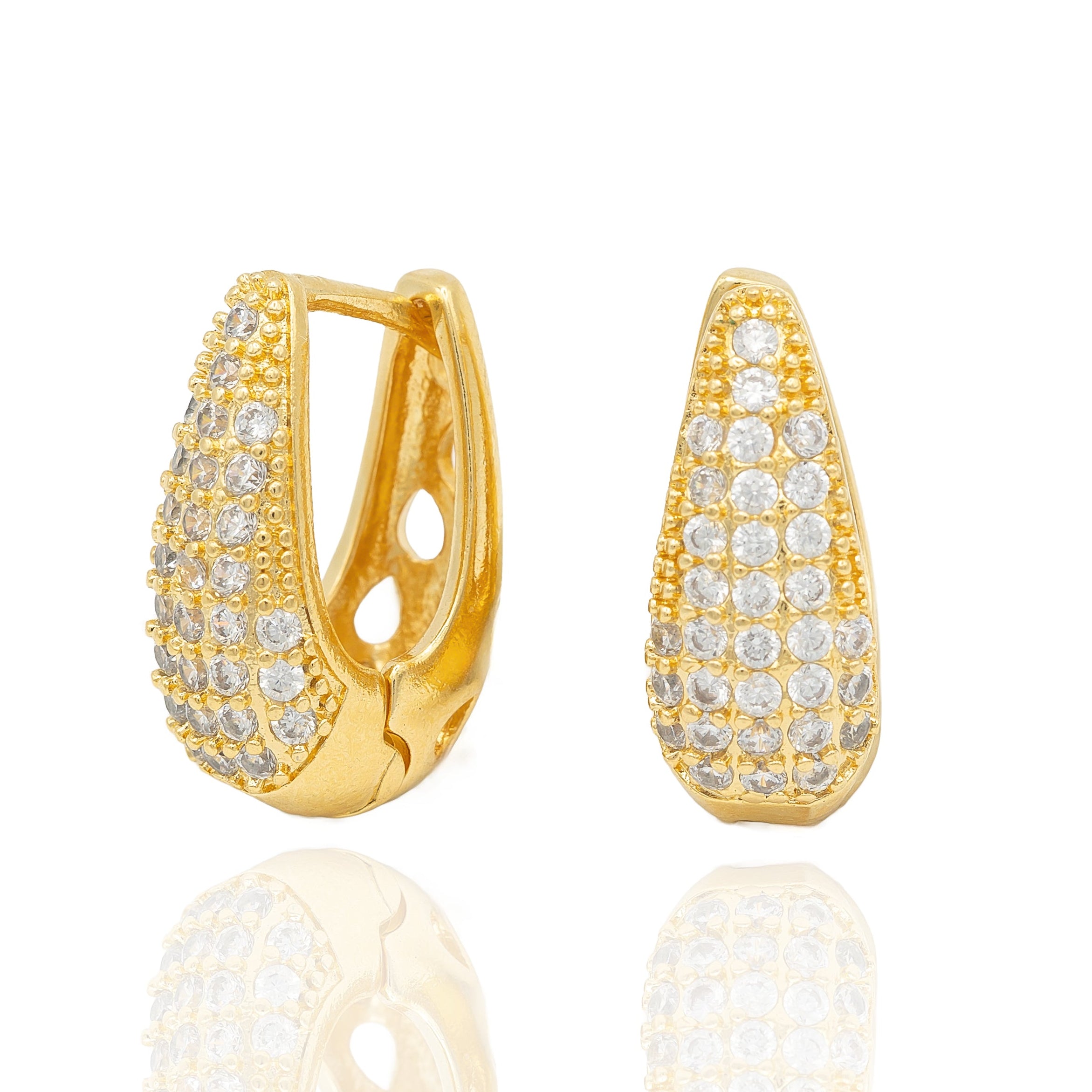 Gold pavé huggie earrings with sculptural glow. Lightweight, hypoallergenic, and elegant - for modern glam with a festive spark by DrammaⓇ.
