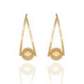  Gold dangle earrings with suspended sphere design. Lightweight, sculptural, and hypoallergenic — bold geometric elegance by Dramma®.