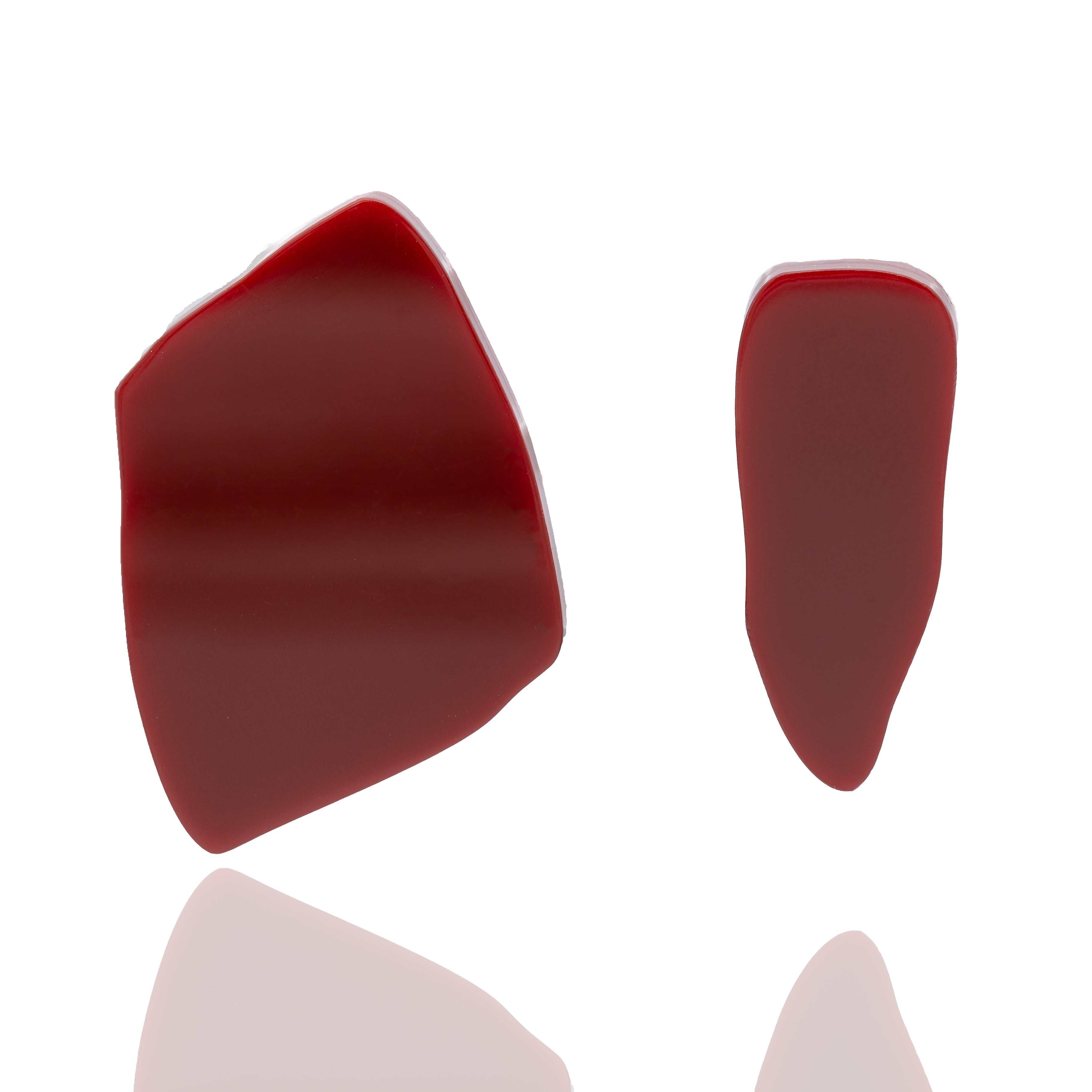Asymmetric acrylic stud earrings in red. Lightweight, hypoallergenic, and handmade — sculptural geometric design with bold personality.