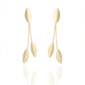 Gold dangle earrings with sculpted leaf design. Lightweight, hypoallergenic, and elegant — refined organic geometry by Dramma®.