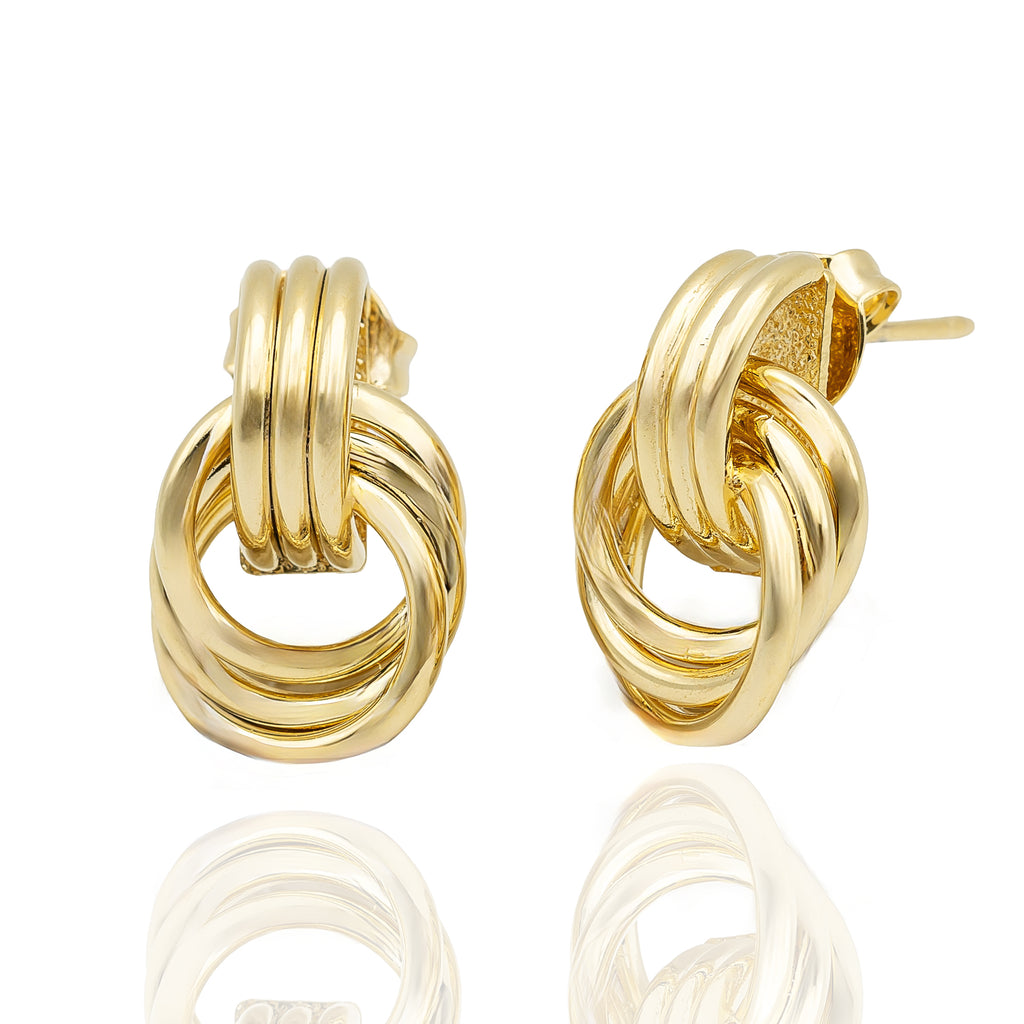 Polished gold stud earrings with interlocking hoops. Lightweight, sculptural, and hypoallergenic — refined modern design by Dramma®.