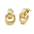 Polished gold stud earrings with interlocking hoops. Lightweight, sculptural, and hypoallergenic — refined modern design by Dramma®.