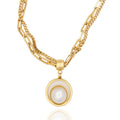  Double gold chain necklace with sculptural pearl pendant. Elegant, modern, and handcrafted with edge by DrammaⓇ.