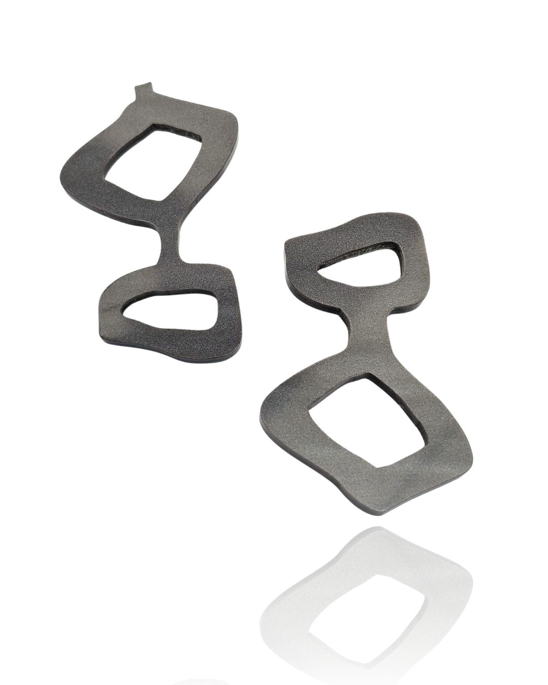 Handmade acrylic statement earrings in graphite gray. Lightweight, graphic, and hypoallergenic — wearable art by Dramma®.