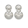  Sculptural silver-tone drop earrings with mirrored finish. Reflective, lightweight, and designed with clean modern geometry by Dramma®
