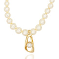 Modern pearl necklace with sculptural gold pendant. Elegant, dimensional, and handcrafted for intentional style by DrammaⓇ.