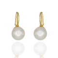 Minimalist gold leverback earrings with a glossy pearl drop. Elegant, lightweight, hypoallergenic. A classic reimagined for the modern wearer by DrammaⓇ.