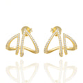  Stellar Angle earrings: sculptural asymmetry, crystal shine, and graphic attitude in a lightweight gold silhouette. Designed for bold style by DrammaⓇ.
