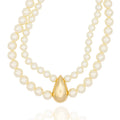 Layered pearl necklace with sculptural gold drop. Elegant, bold, and handcrafted. For timeless drama with modern attitude by DrammaⓇ.

