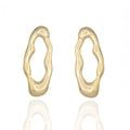 Gold-tone sculptural drop earrings with molten organic shape. Reflective, bold, and architecturally expressive by Dramma®.
