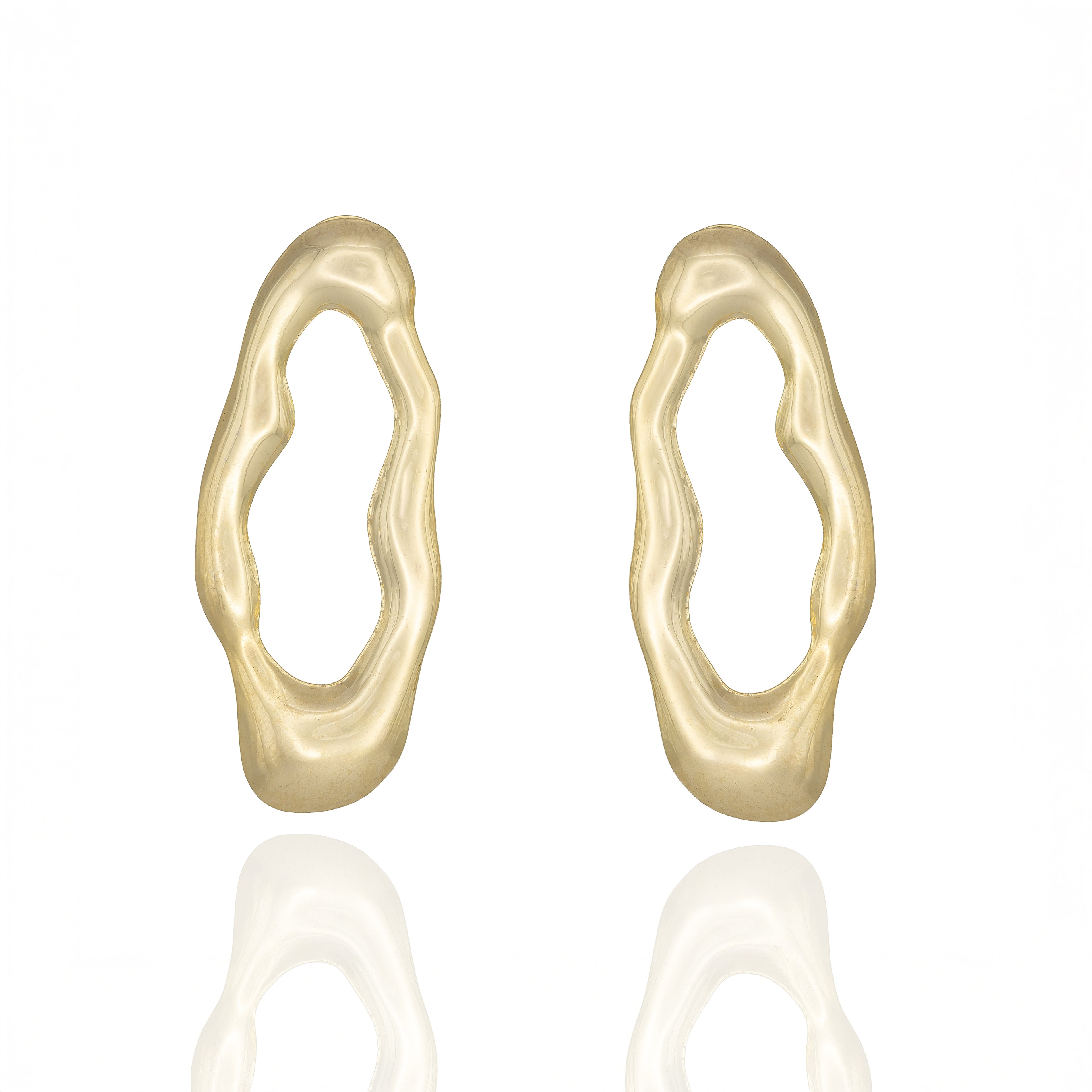 Gold-tone sculptural drop earrings with molten organic shape. Reflective, bold, and architecturally expressive by Dramma®.
