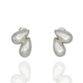 Sculptural silver teardrop studs with mirrored design. Lightweight, modern, and hypoallergenic — refined minimalism by Dramma®.